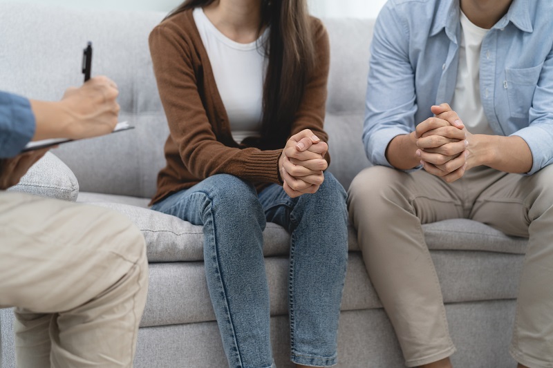 couple relationship therapy with a counselor. Close Up hands of the woman client during a conversation with psychologist to find problems and solution. Collaborative Divorce, Collaborative Practice Kansas City, Why it Could be Right for You